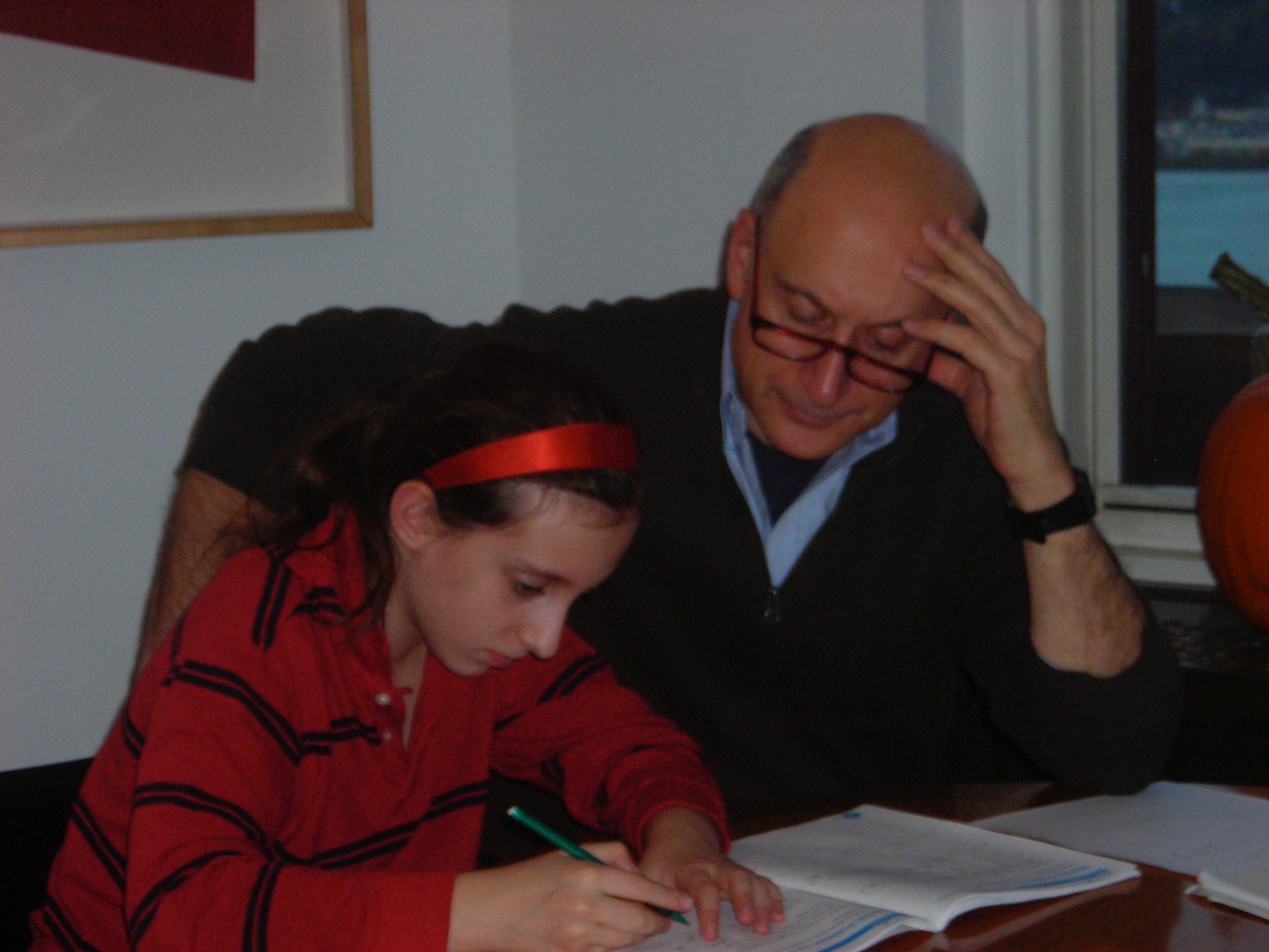 Author Warren Kozak, helping his daughter with homework